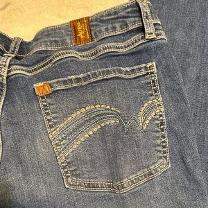104.  Women’s Blue Boot Cut Jeans by Aura size 12